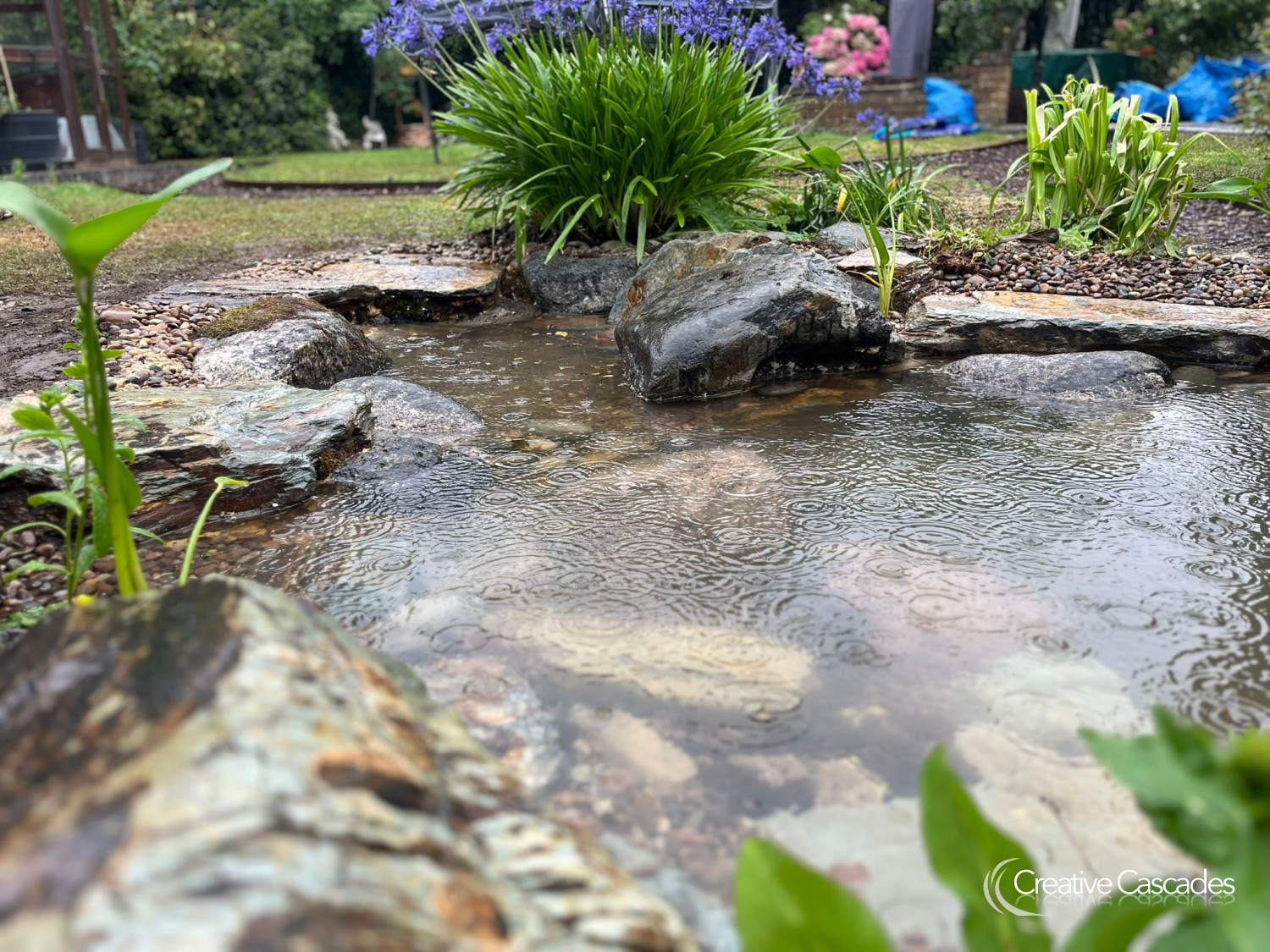 Intake bay on a rainy afternoon, the day we finished this pond build  - Landscaping and Water Features -  Creative Cascades